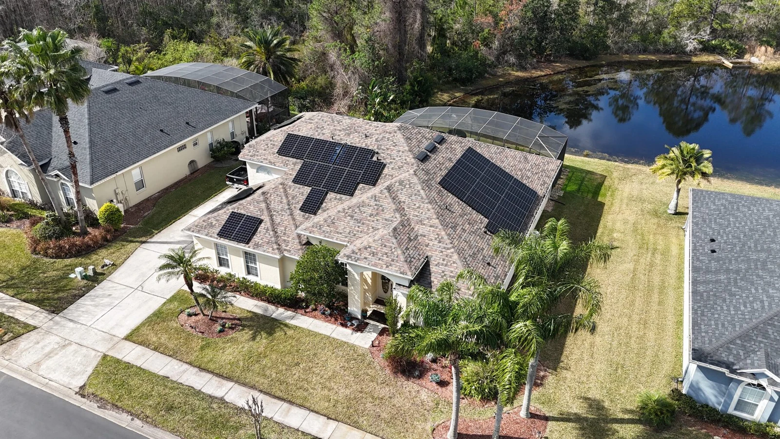 Solar panels installed by Sunstorm on a lakeside Central Florida home